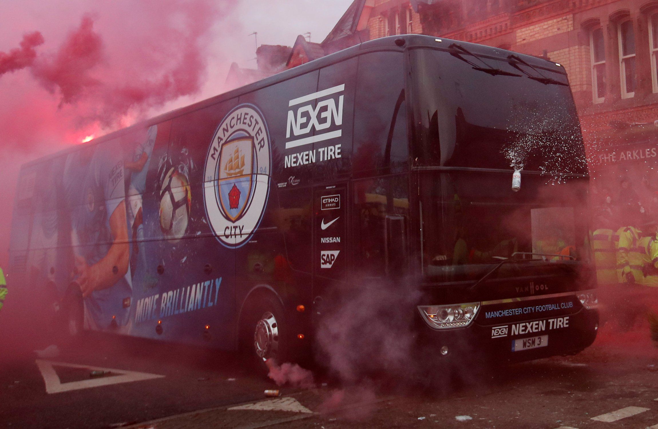 Manchester City's team bus is attacked by Liverpool fans