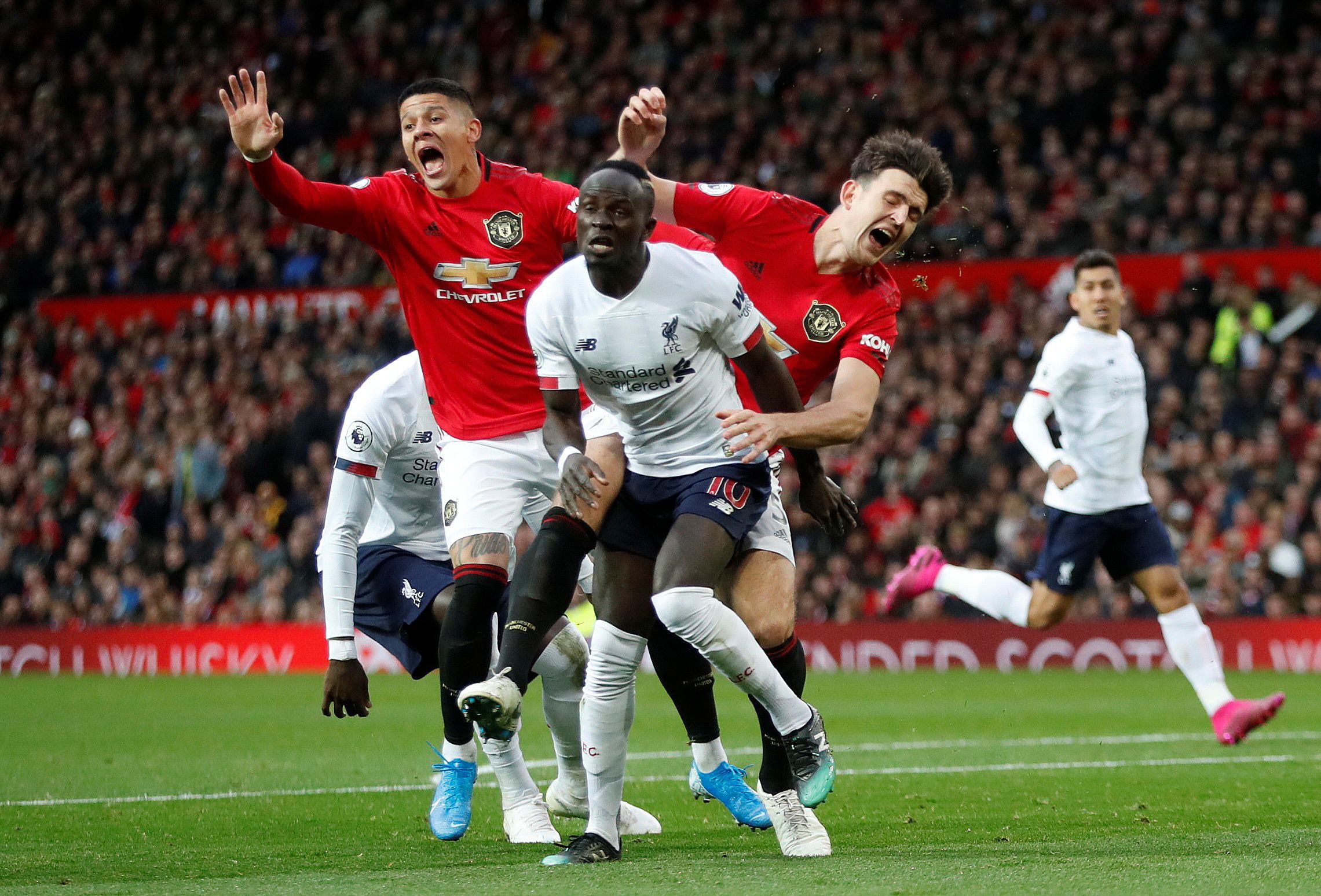 Sadio Mane gets the better of Harry Maguire and Marcos Rojo