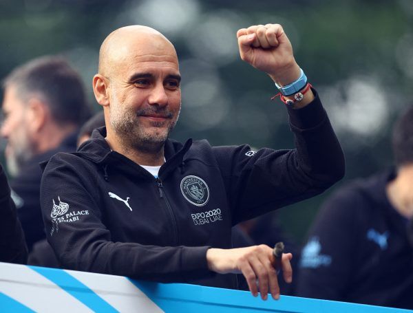 Pep Guardiola in action for celebrating Manchester City win